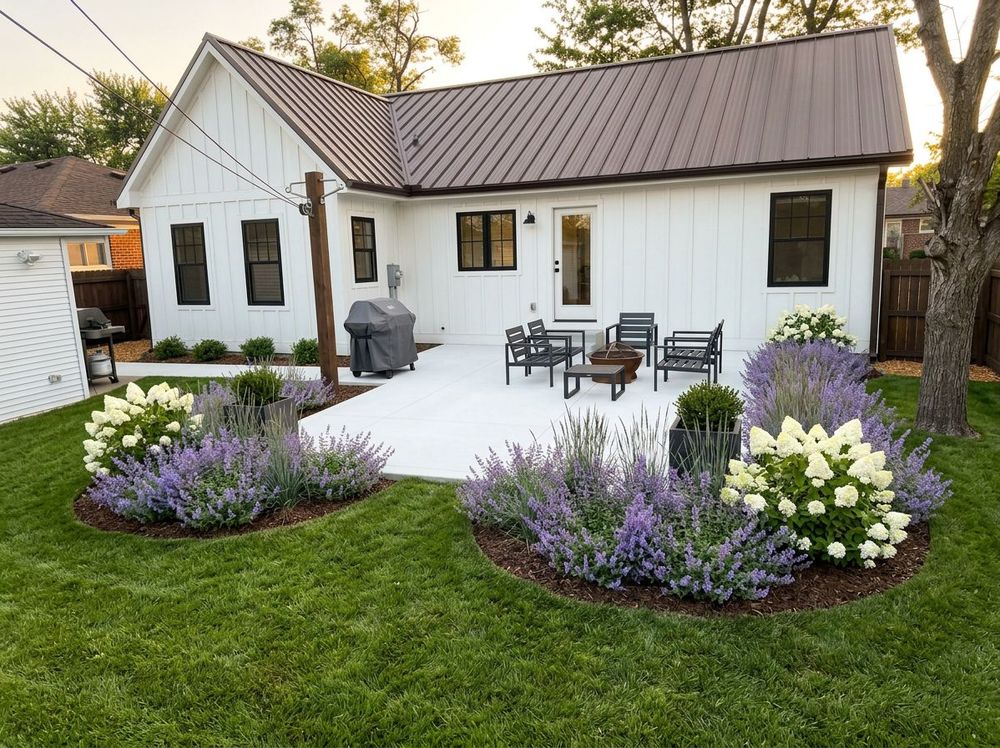 Concrete patio with deeper edge planting and a softer planted buffer
